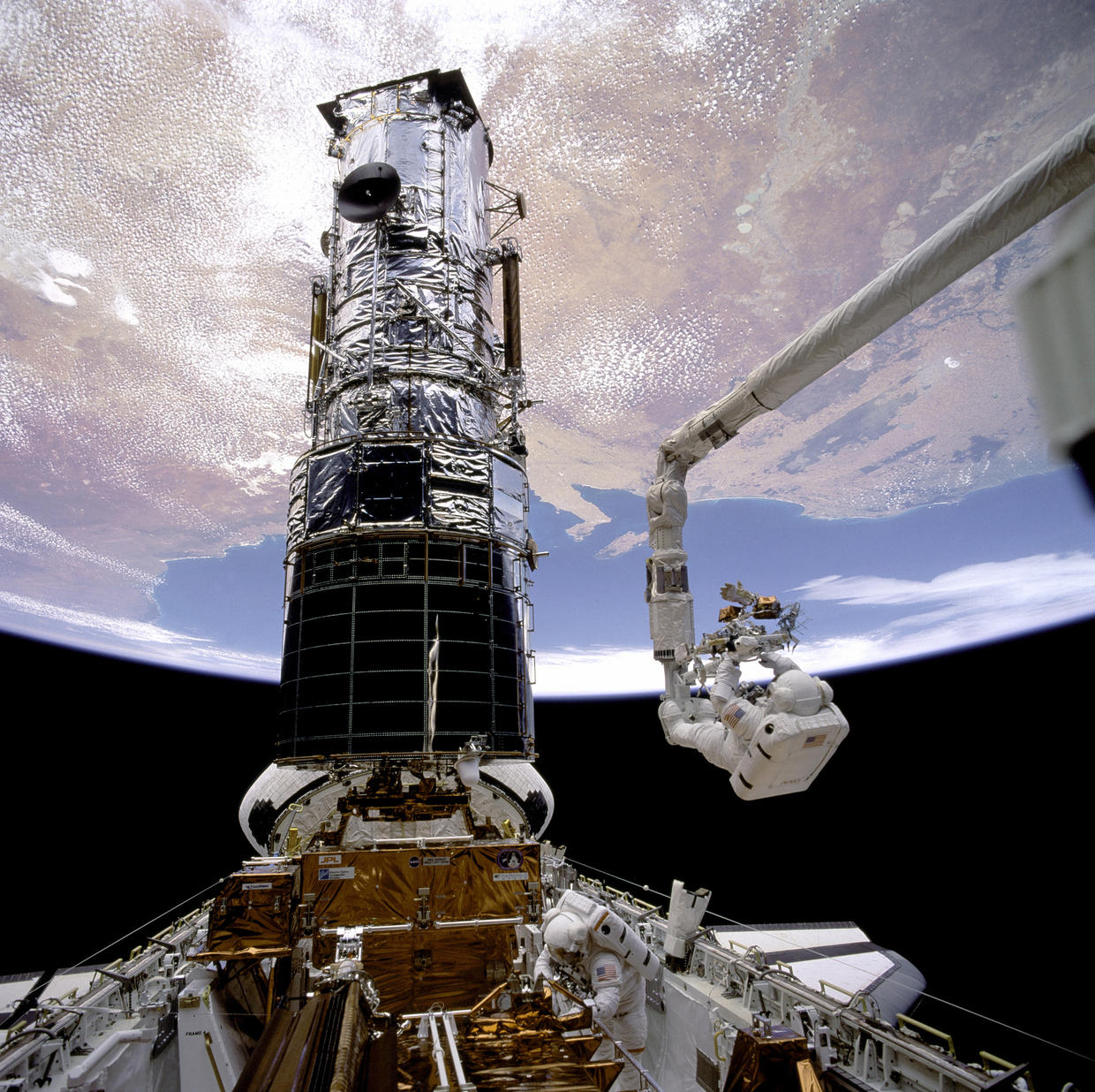 space shuttle through telescope