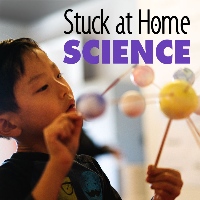 Stuck at Home Science logo with boy participating in hands-on science activity