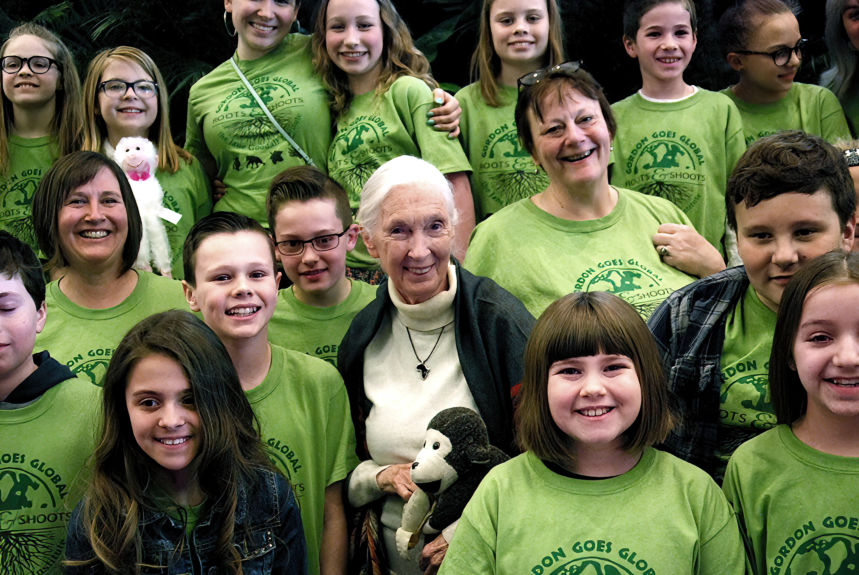 Dr. Jane Goodall poses for a photo with members of the Jane Goodall Institute's Roots & Shoots program.