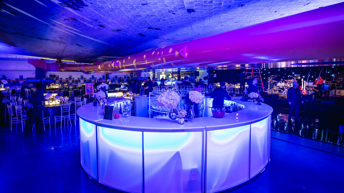 Round glowing bar under the belly of the Space Shuttle Endeavour