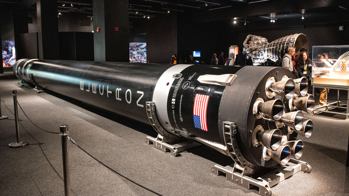 Rocket Lab's Electron rocket displayed on its side inside the Work in Progress gallery