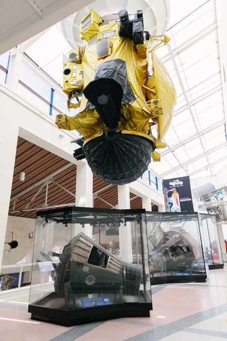 Mercury, Gemini, and Apollo space capsules on Disney Science Court with Cassini-Huygens model seen overhead