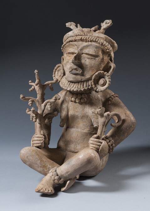 Censer in shape of a seated figure. 
